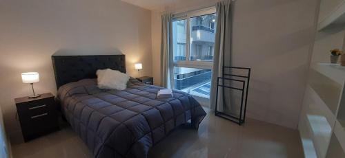 Postel nebo postele na pokoji v ubytování Torre Opera Depto 3º B