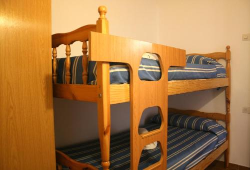 two bunk beds in a small room with at Apartamento en primera linea de mar en Pals 306-1 2H in Pals