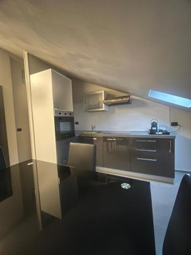 a small kitchen with a table and a counter top at Smart Hotel in Carpi