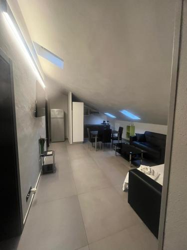 a living room with a couch and a table at Smart Hotel in Carpi