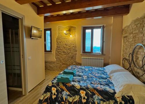 Postel nebo postele na pokoji v ubytování La torre tra terra e cielo