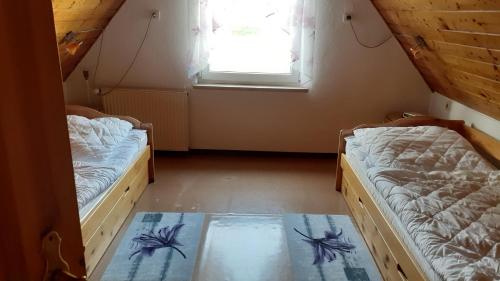 Postel nebo postele na pokoji v ubytování Ferienwohnung Hähnlein
