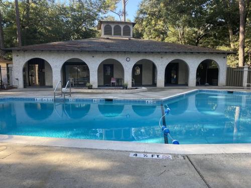 a swimming pool in front of a building at Peaceful Relaxation and Comfort in Hilton Head Island