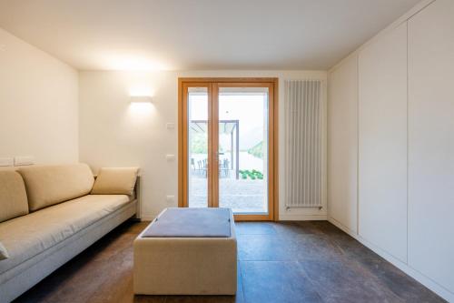 a living room with a couch and a table at Agriturismo Scraleca in Angolo Terme