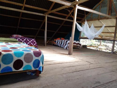a room with two beds in a tent at montecristo hostel in Santa Marta