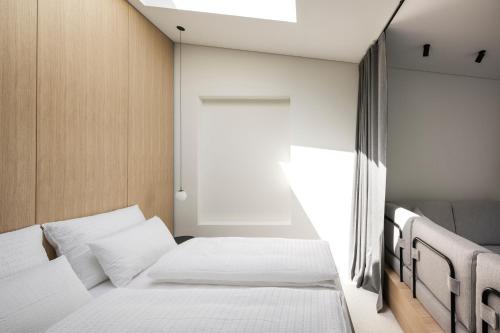 Mynt Merano Roomsにあるベッド