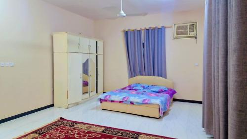 فيلا عوقد Villa of Awqadにあるベッド