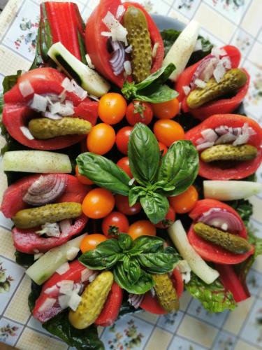 a pile of vegetables sitting on a table at Dom w Siedlisku pod Orzechem in Przyłęk