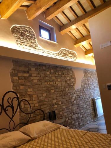 Postel nebo postele na pokoji v ubytování La torre tra terra e cielo