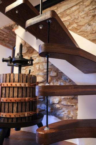 a wooden spiral staircase in a building at Ca'Toni in Bagnone