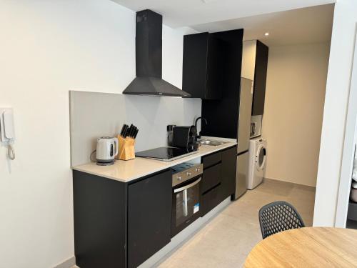 Η κουζίνα ή μικρή κουζίνα στο Palm Beach Rentals
