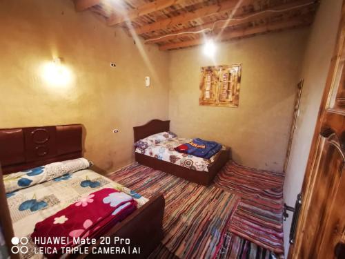2 Aparte Bedden in een kamer met 2 bedden van 6 x 7 cm bij Karam Sands in Siwa