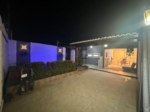 a night view of a house with a patio at Casa Aconchegante com Piscina in Petrolina
