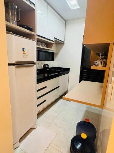 Kuchyň nebo kuchyňský kout v ubytování Casa Aconchegante com Piscina