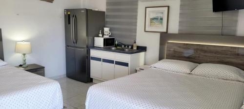 Ένα ή περισσότερα κρεβάτια σε δωμάτιο στο Playa Apartments