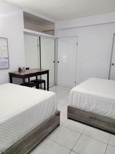 Ένα ή περισσότερα κρεβάτια σε δωμάτιο στο Playa Apartments