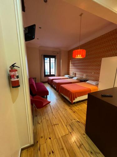 Ένα ή περισσότερα κρεβάτια σε δωμάτιο στο AMSTELHUIS APARTMENTS PROVIDENCIA Santiago Baquedano