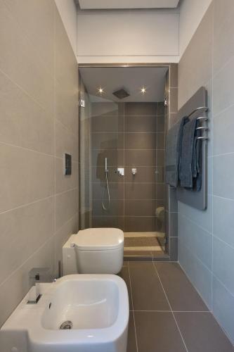 a bathroom with a toilet and a sink and a shower at Estate4home - Surreo Luxury B&b in Sorrento
