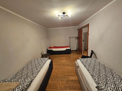 Katil atau katil-katil dalam bilik di Apartament w Kamienicy w Centrum Kalisza