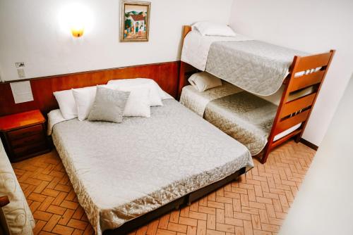 Hotel Posada Campestre San Gilにあるベッド