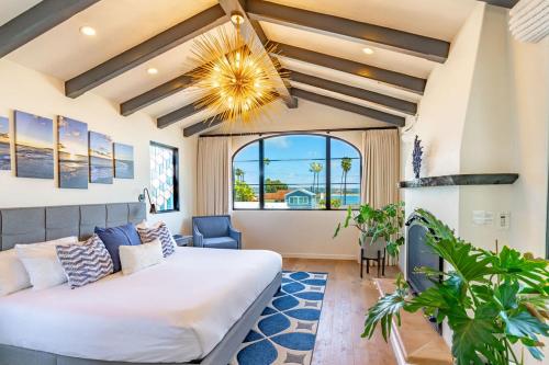 a bedroom with a large bed and a large window at Spanish Villa with View Pool and Spa in San Diego