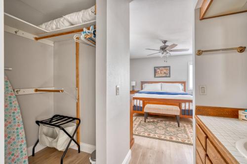 a bedroom with a bed and a bathroom at Welcome to the Kinglet's Nest, Spacious property with AC SHARC, Hot-tub, Bikes, Games, Grill, Golf and Pets in Sunriver