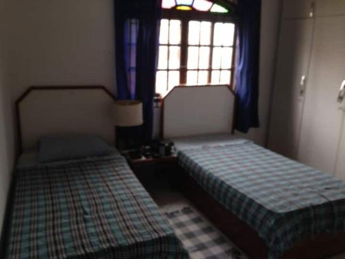 Katil atau katil-katil dalam bilik di hostel casa de praia suites