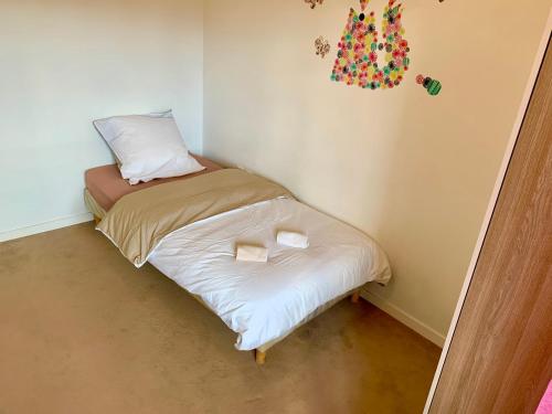 Ένα ή περισσότερα κρεβάτια σε δωμάτιο στο Appartement spacieux