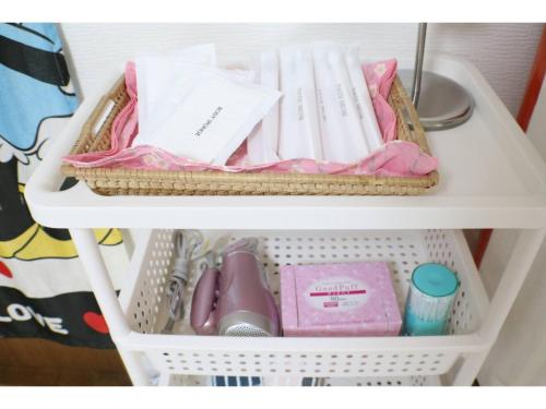 a white shelf with a drawer filled with pink items at La Mer Urayasu - Vacation STAY 11148 in Urayasu