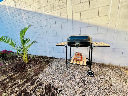 a grill sitting on a table next to a wall at Sun Shine Entire Home Santa Ana in Santa Ana