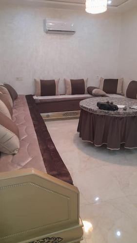 a living room with a couch and a table at Apartment in Nador in Nador