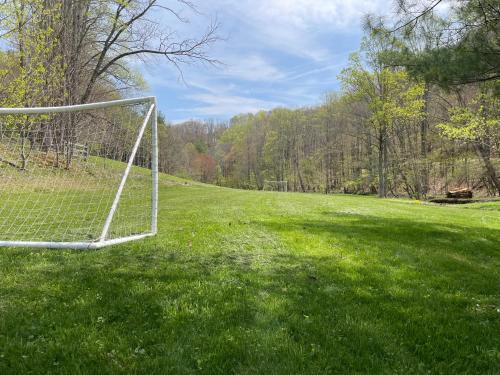 a soccer goal in the middle of a field at Creekside Getaway - King Bed - Full Kitchen in Boone