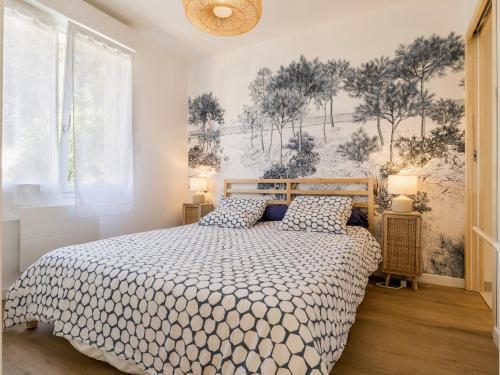 a bedroom with a bed and a large painting on the wall at Maison rénovée 2023 à 300m de la mer avec terrasse, jardin clos, clim et wifi - FR-1-306-1270 in Saint-Brevin-les-Pins
