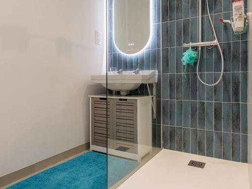 a bathroom with a sink and a mirror at Maison rénovée 2023 à 300m de la mer avec terrasse, jardin clos, clim et wifi - FR-1-306-1270 in Saint-Brevin-les-Pins