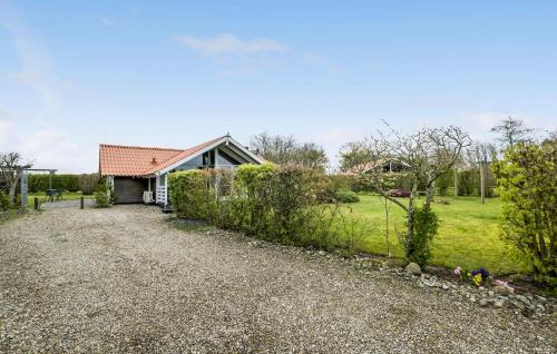 a house with a garden and a gravel driveway at Beautiful Home In Sydals With Kitchen in Sønderby