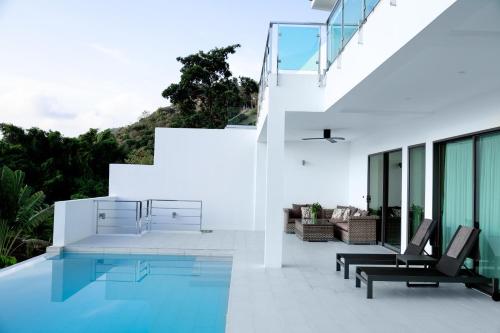 an image of a house with a swimming pool at Harmony Sea View Villa in Chaweng Noi Beach