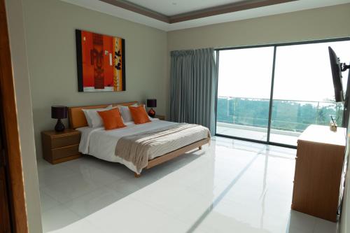 Katil atau katil-katil dalam bilik di Harmony Sea View Villa