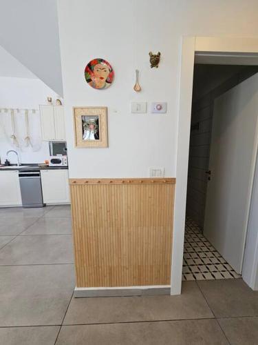a kitchen with a wooden counter in a room at HaKerem new luxury 3 rooms apartments and 2 rooms penthaus in Tel Aviv