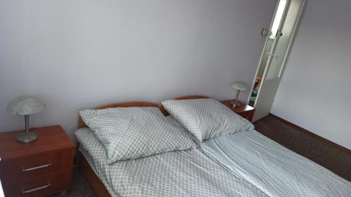 Ένα ή περισσότερα κρεβάτια σε δωμάτιο στο Giżycko WP30