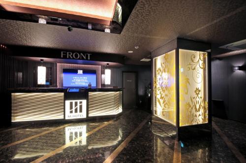 a front lobby of a hotel with a front desk at M'z HOTEL in Nagoya