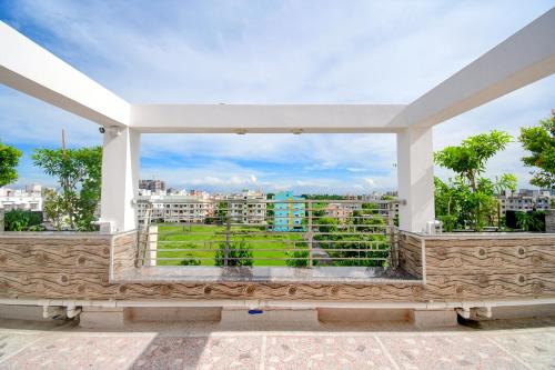 a balcony with a view of a city at Anchorage Inn in Thākurdwari