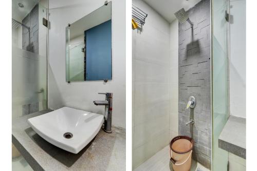 a bathroom with a sink and a shower at HOTEL BB HOUSE in Mumbai