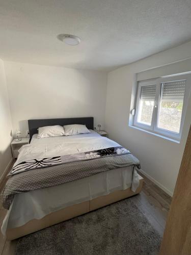 Llit o llits en una habitació de Apartman Milica