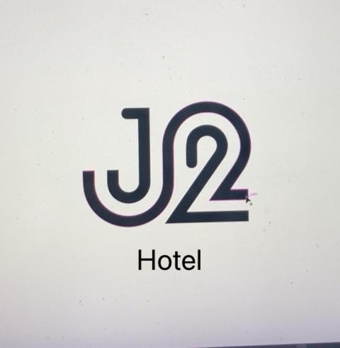 a sign for a hotel with the number twelve at J2 Hotel in Kamphaeng Phet