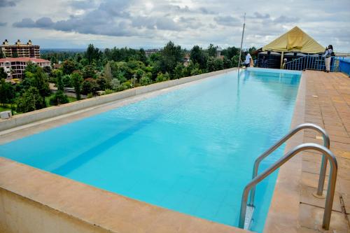 a large swimming pool on top of a building at JoJo Jovial Homes in Kiambu