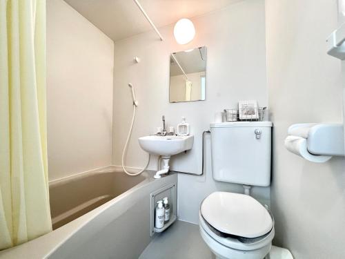 a small bathroom with a toilet and a sink at 東田端2F-kKI0064 in Tokyo