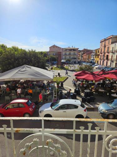 a group of cars parked in a parking lot at La Dama del Castello in Bosa