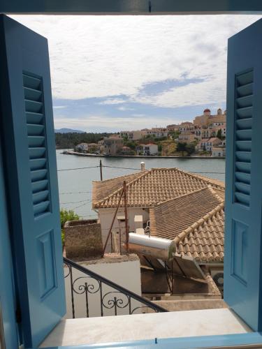 a view of the water from a balcony at Galaxa Mansion in Galaxidhion