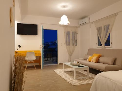 a living room with a couch and a table at Galaxa Mansion in Galaxidhion