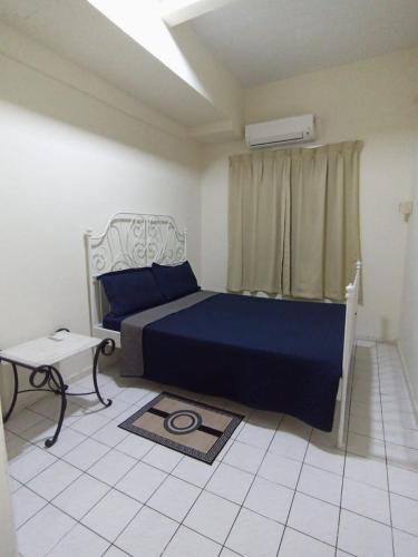 Ένα ή περισσότερα κρεβάτια σε δωμάτιο στο Paradise Lagoon Apartment PD
